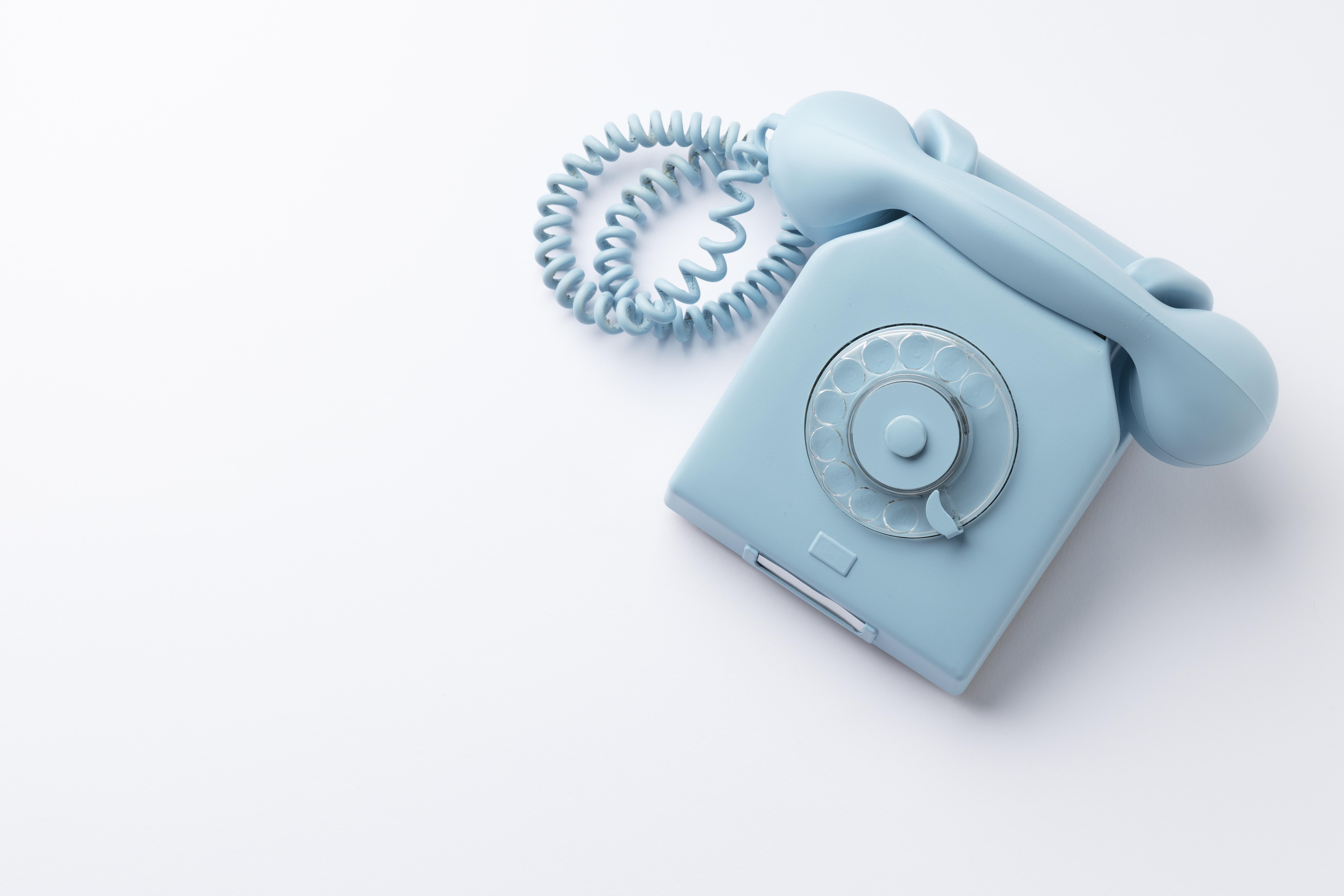 blue telephone on white background